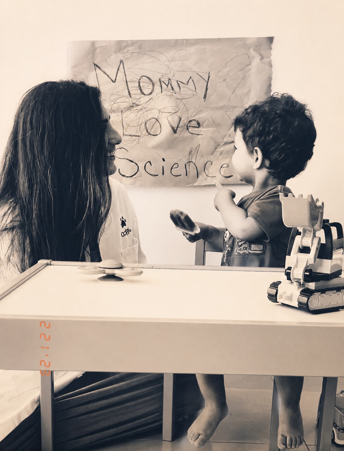 A mother and young child sharing a curious moment together at home
